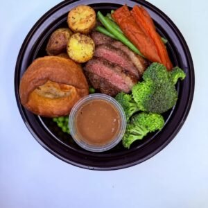 Diced Sunday Roast with sirloin beef, roast potatoes, Yorkshire pudding, honey glazed carrots and greens
